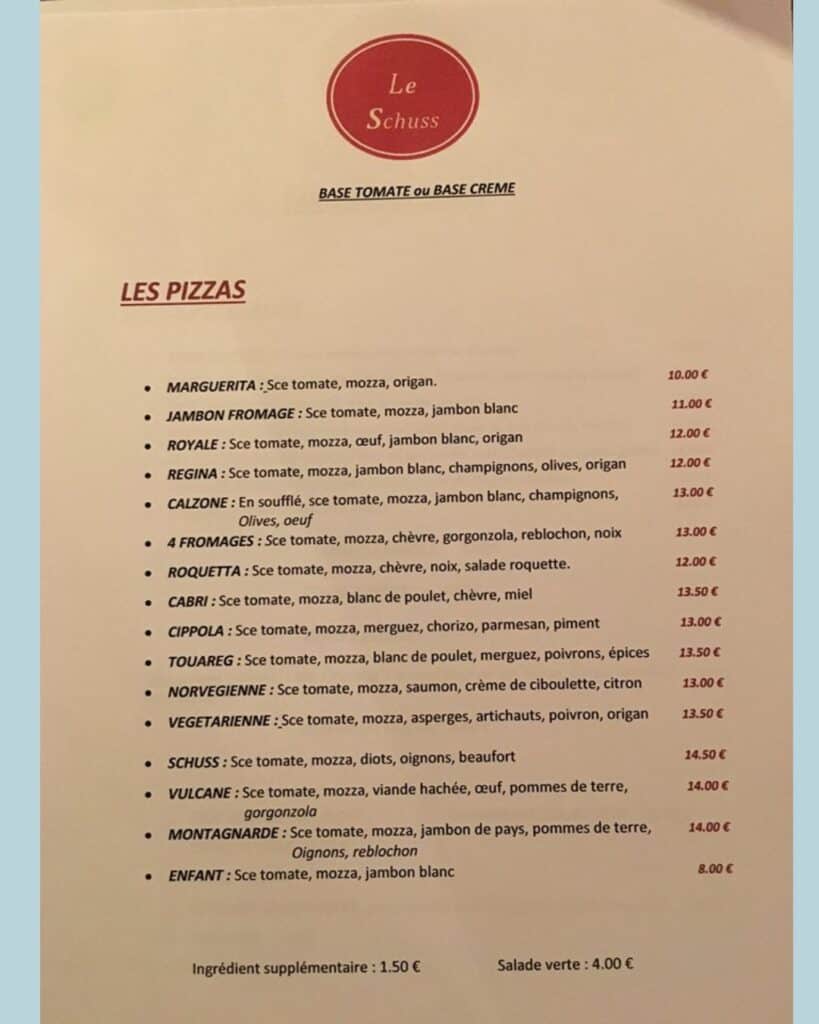 Le Schuss pizza menu featuring a wide range of pizzas with tomato or cream bases, including Margherita, Royale, Calzone, and regional specialties like the Montagnarde and Schuss pizzas.