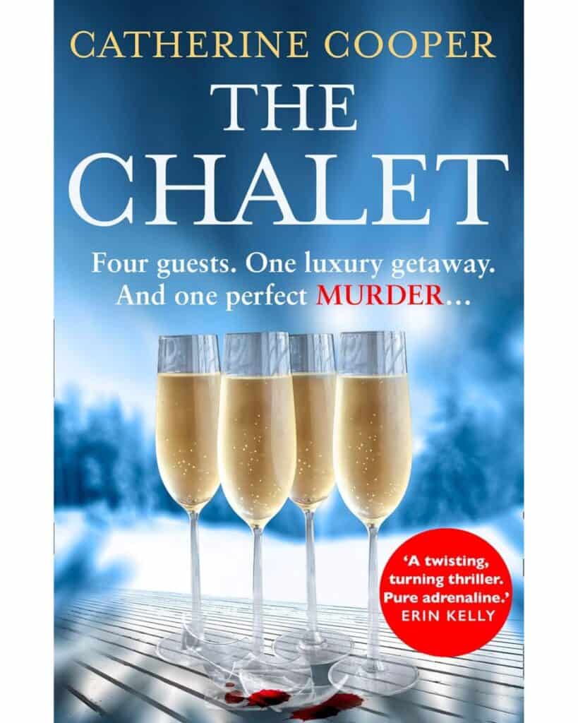 Book cover for The Chalet by Catherine Cooper, featuring four champagne flutes standing on a snowy deck with blood drops below them, against a backdrop of misty blue mountains. Tagline reads, "Four guests. One luxury getaway. And one perfect MURDER..."