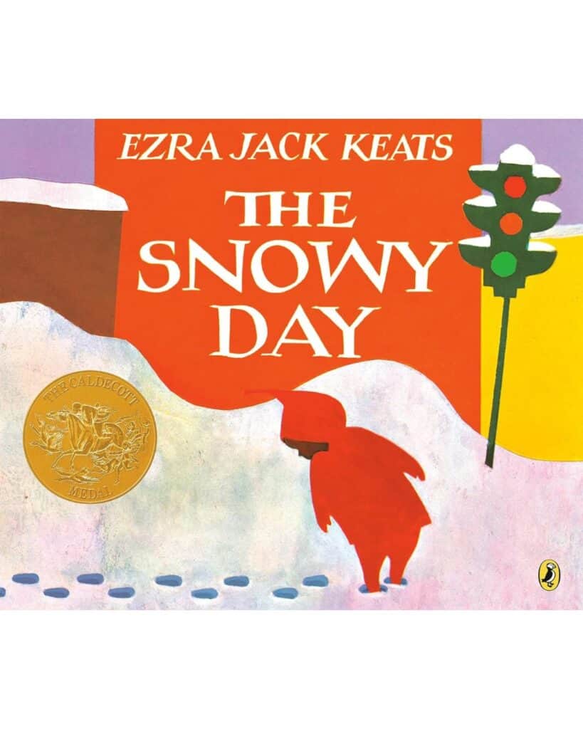 Book cover for The Snowy Day by Ezra Jack Keats, depicting a small child in a red snowsuit walking through deep snow beneath a red-orange sky, leaving footprints behind. A Caldecott Medal is displayed on the cover.