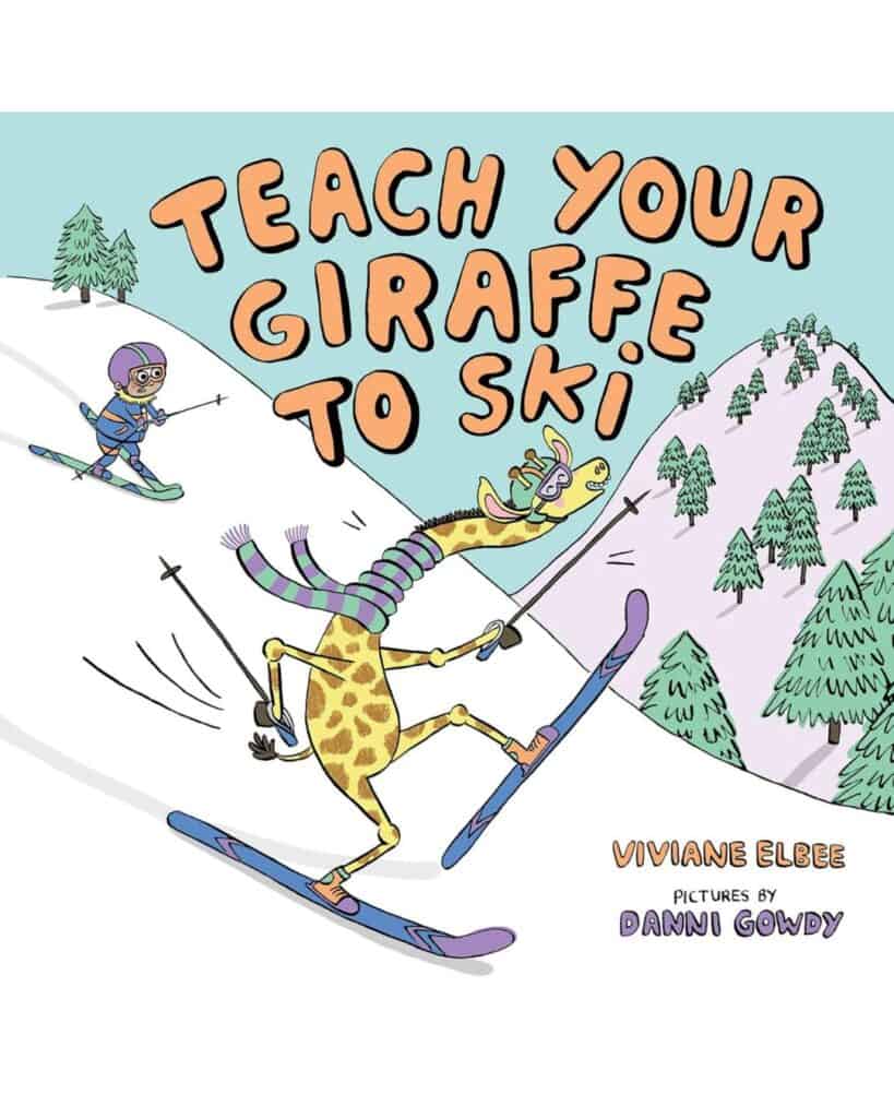 Book cover for Teach Your Giraffe to Ski by Viviane Elbee, illustrated by Danni Gowdy, showing a tall, awkward giraffe on skis wobbling downhill while a child skier follows behind, set against a snowy forest.