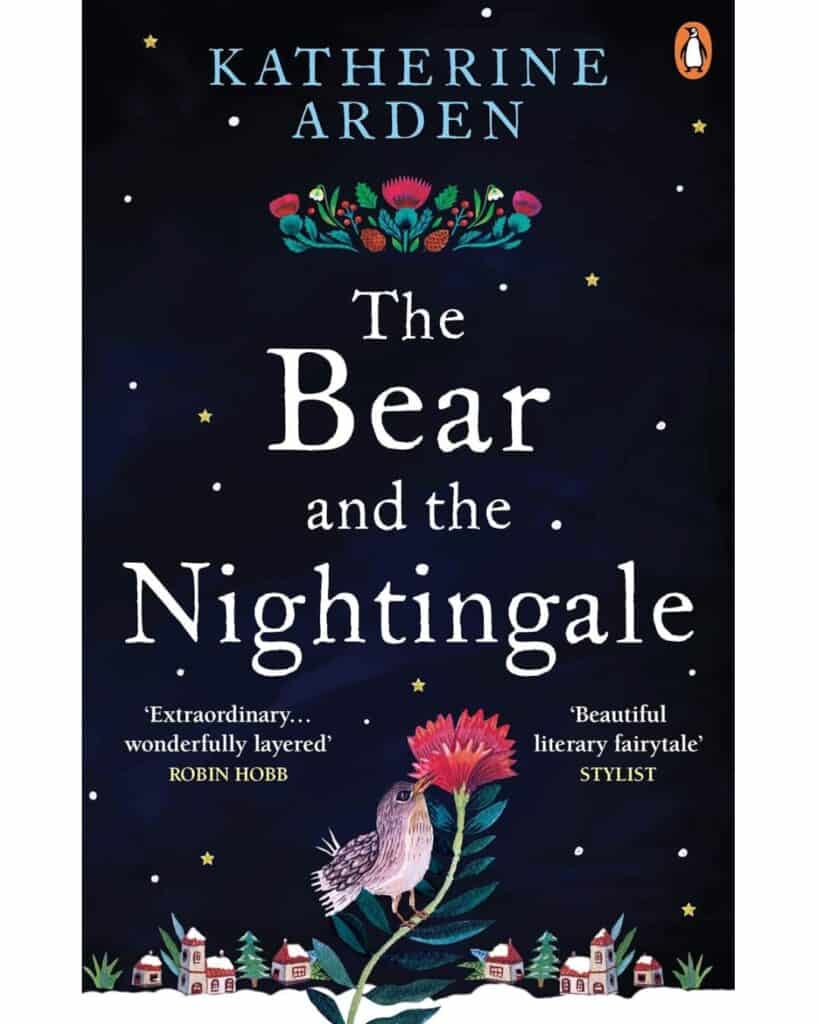 Book cover of The Bear and the Nightingale by Katherine Arden, featuring an illustrated bird perched on a pink flower, with a snowy village at the bottom and stars scattered across a dark blue night sky.