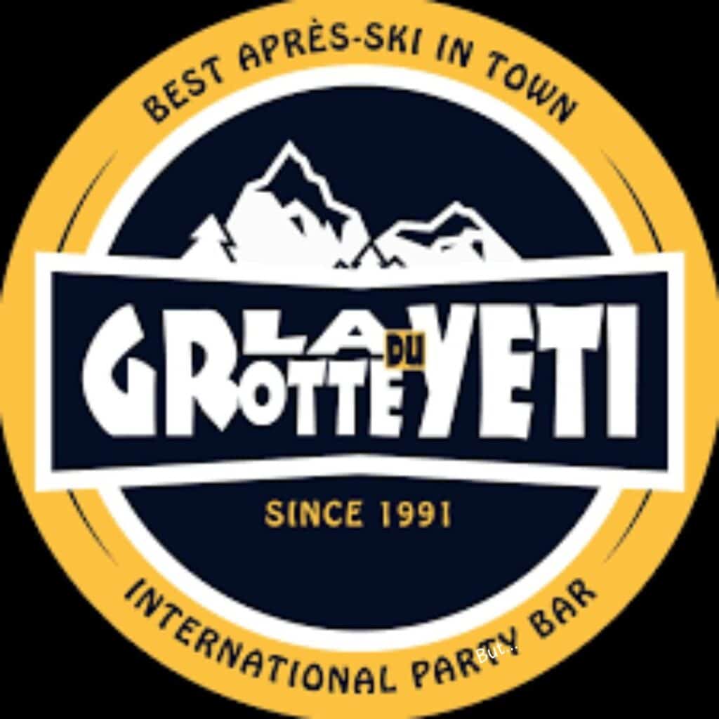 Circular logo for La Grotte du Yeti, an international party bar, featuring bold text over mountain silhouettes. The outer ring reads “Best Après-Ski in Town” at the top and “International Party Bar” at the bottom, with “Since 1991” noted in the centre.