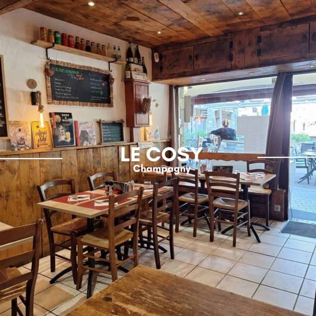 LE COSY, Champagny – A traditional wooden restaurant with a welcoming, intimate setting. Chalkboard menus, vintage ski posters, and warm wooden furnishings create a nostalgic alpine dining experience.