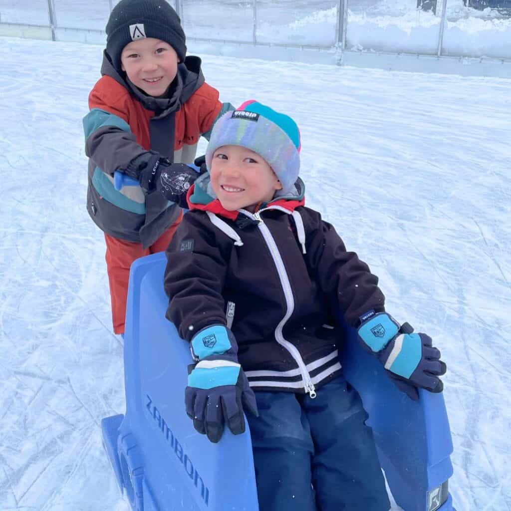 Kids enjoying the open-air ice rink at Plagne Centre, highlighting the family-friendly atmosphere near some of the best accommodation Plagne Centre offers.