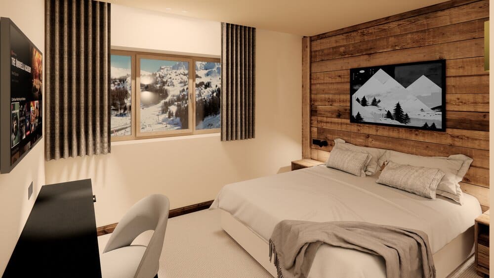Cozy guest room at Hotel Graciosa in La Plagne, featuring mountain views, wood accents, and a plush bed — a perfect VIP SKI retreat after a day on the slopes.