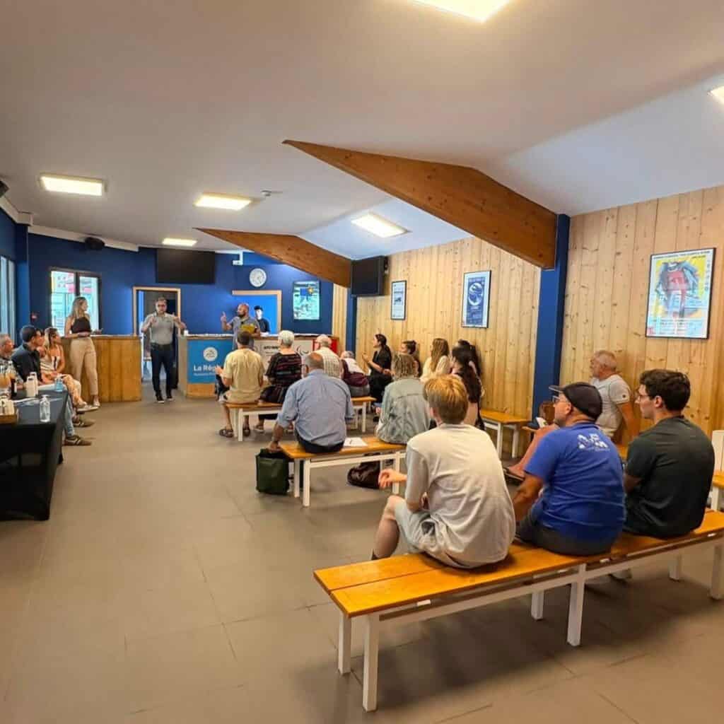 Members of the public gather at La Plagne's Olympic bobsleigh track during a guided walk to learn about the planned renovation works before the 2030 Winter Olympics.